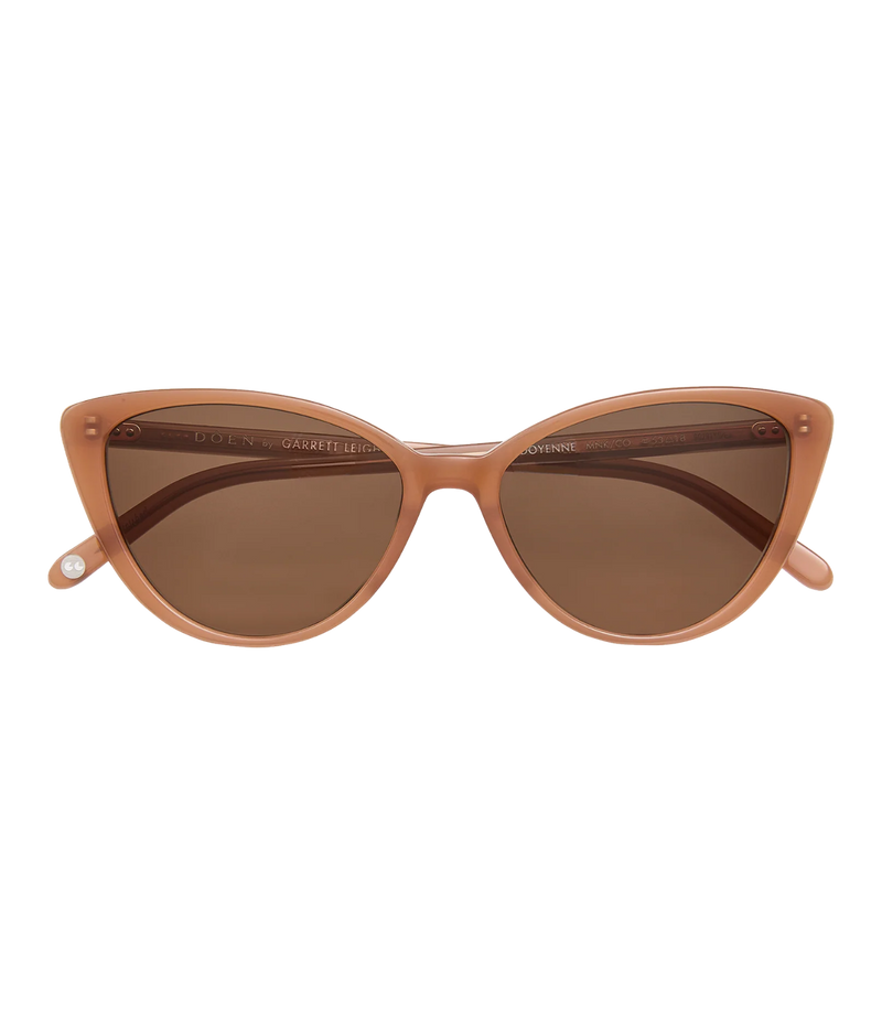 Cats-eye sunglasses with a translucent peach-pink frame and brown tinted lenses