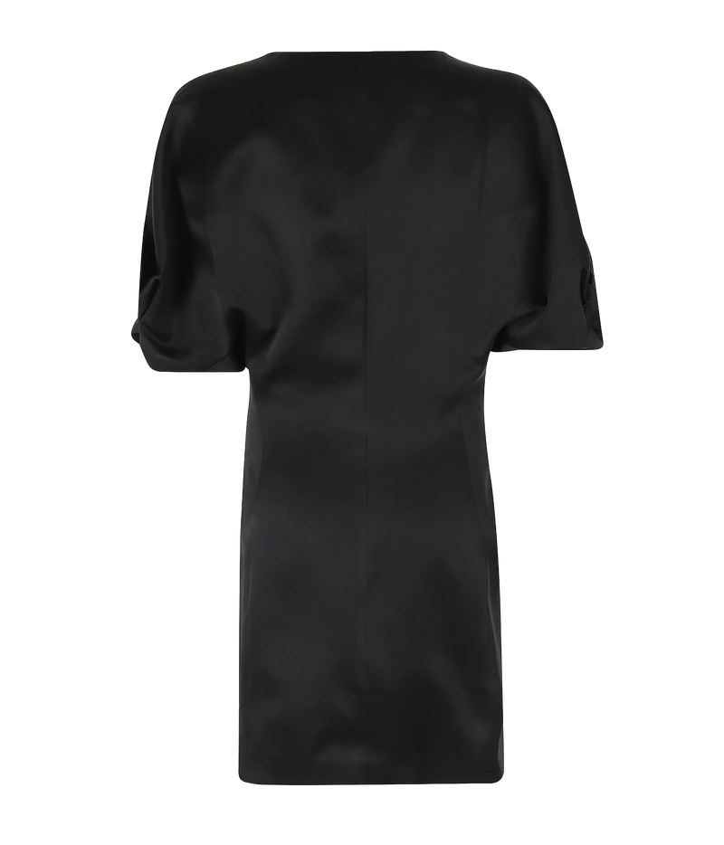 Back view of the Raquel Diniz Anastasia Short Dress in Black laid flat, showing the rounded draped sleeves and straight mini length