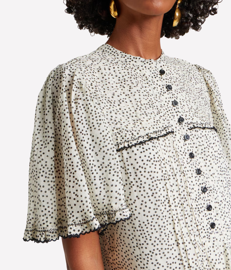 Isabel Marant Daynia Cotton Mini Dress in Ecru Black, side model view highlighting the relaxed mini silhouette and scalloped hem.