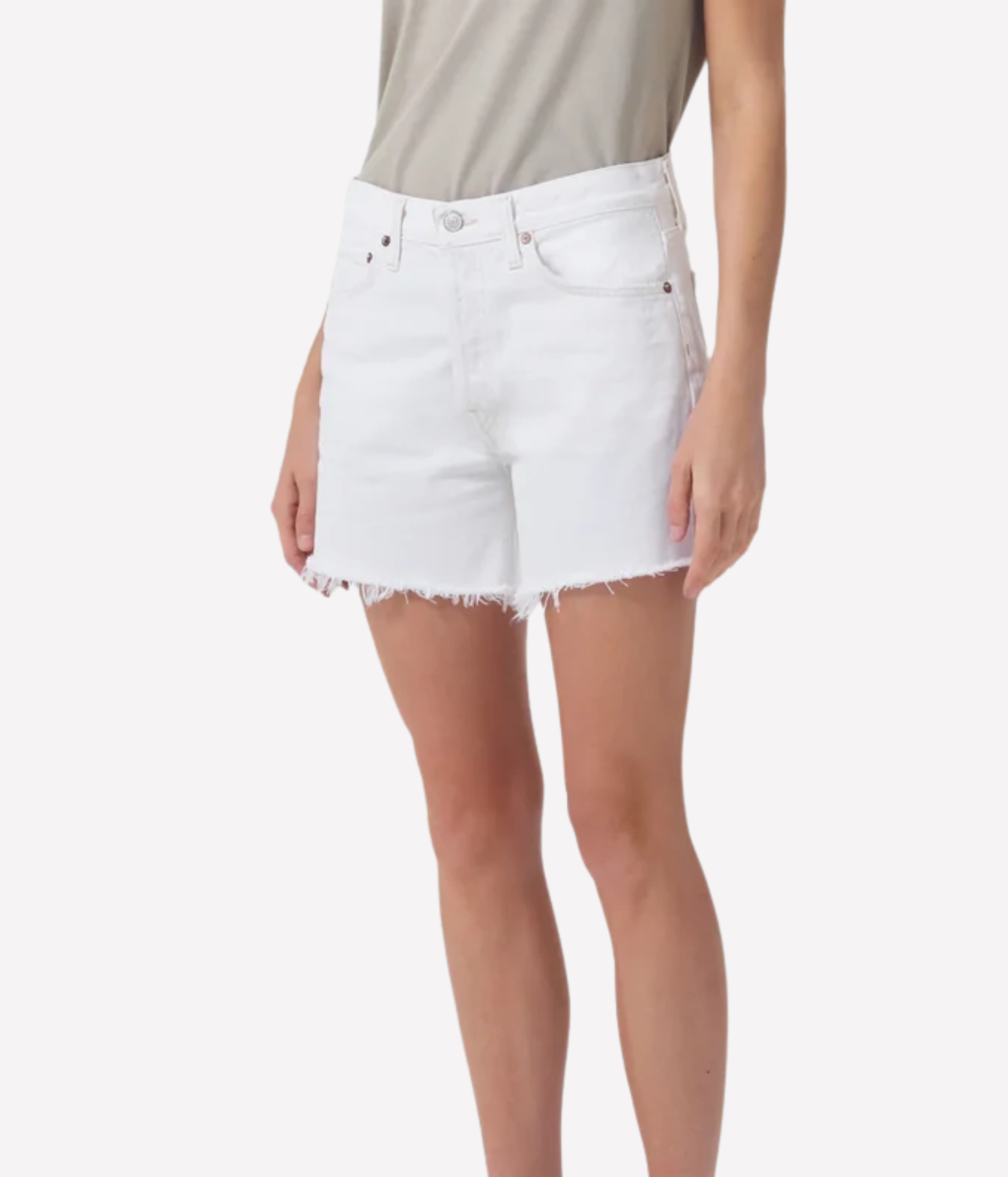 White denim shorts with a raw, frayed hem, shown on a model wearing a light beige top against a plain white background.