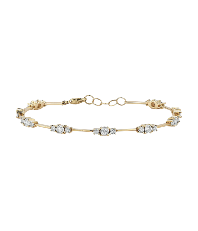 Dana Rebecca Designs Ava Bea Spaced Tennis Bracelet in 14k Yellow Gold laid flat, showing white diamond stations spaced between slim yellow gold bars and the lobster clasp