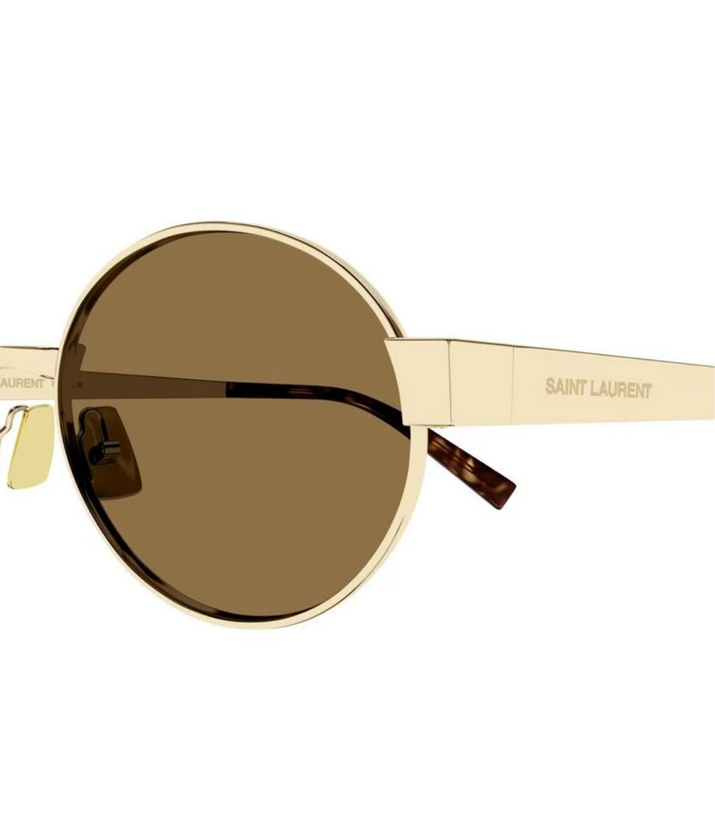 Close side view of Saint Laurent SL 692 Oval Metal Sunglasses in Gold Brown showing the oval lens and engraved temple