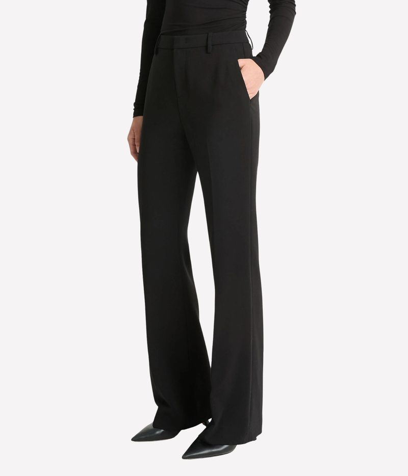 A model wearing black wide-leg trousers