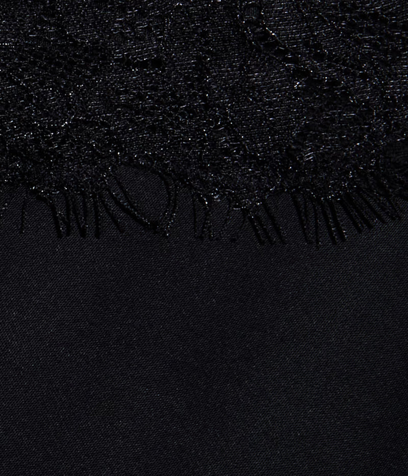 Close-up of the L'AGENCE Elka Satin Lace Camisole in Black. Showing its textured fabric with a lace trim along the top edge and a smooth black fabric below.