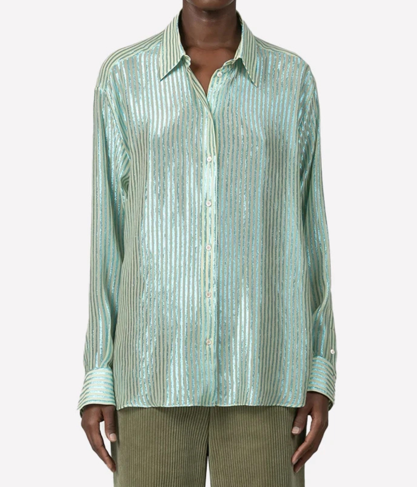 A model wearing a mint green striped long-sleeve button-up shirt