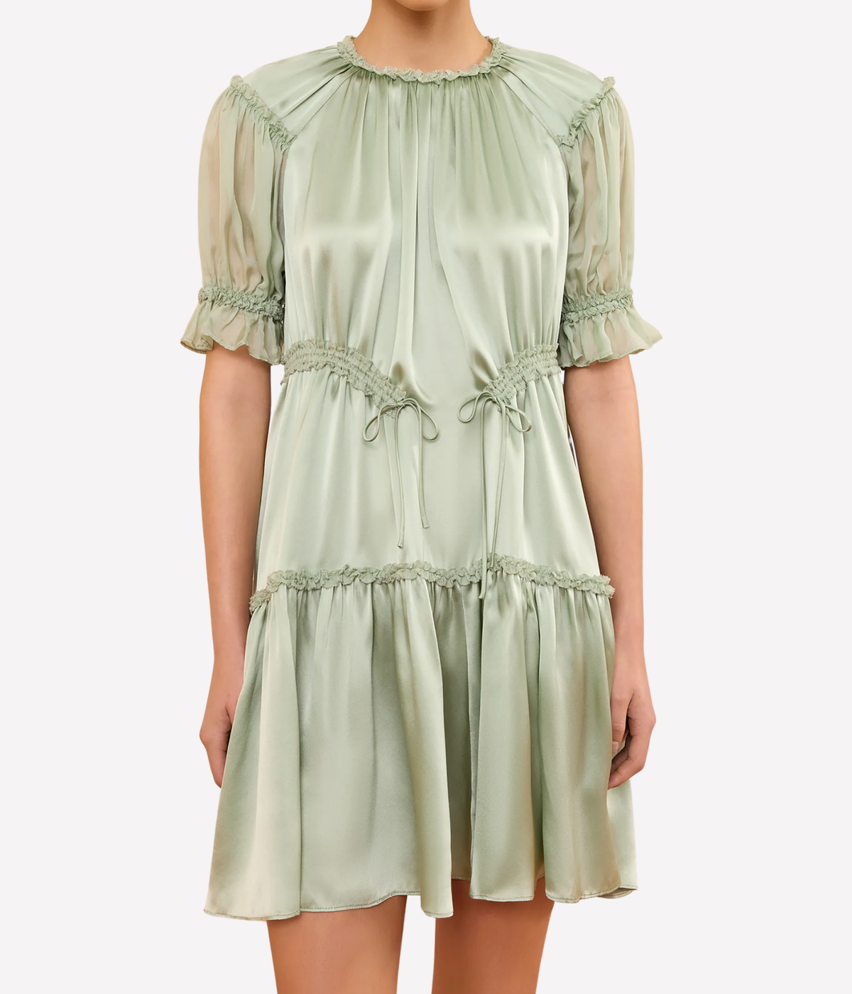 Model wearing the Juliette Short Sleeve Mini Dress in Cleadon, shown from the front with its gathered neckline, short puff sleeves and tiered mini skirt.
