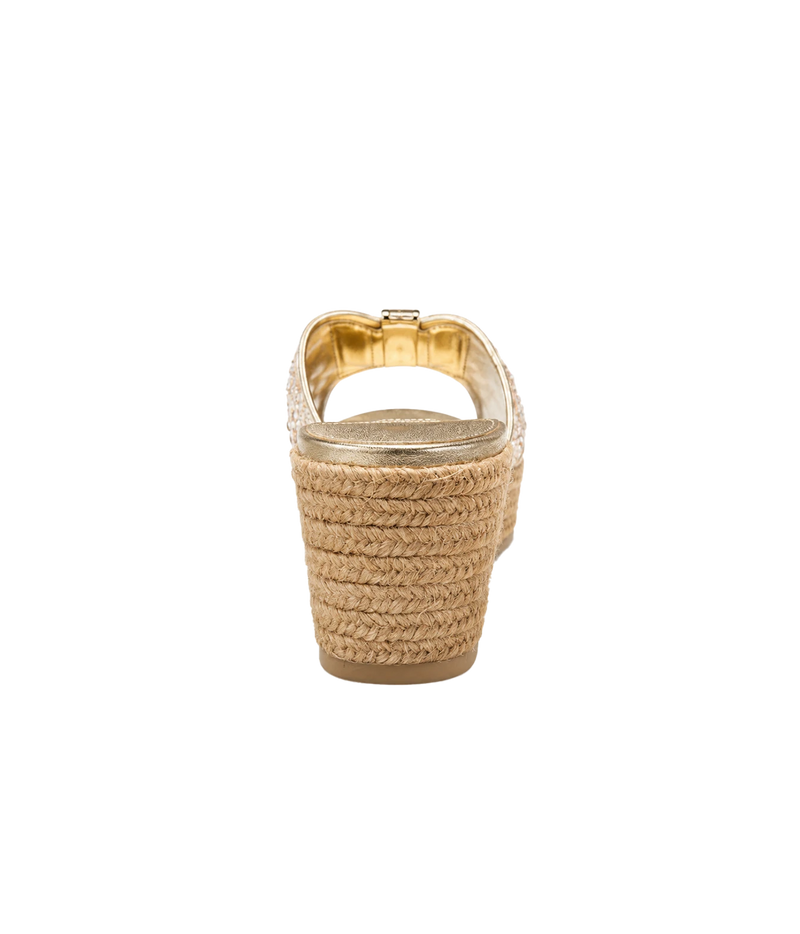 A single women's espadrille wedge sandal shown from the back, featuring a woven natural jute heel and a metallic gold slingback strap with a small gold buckle.