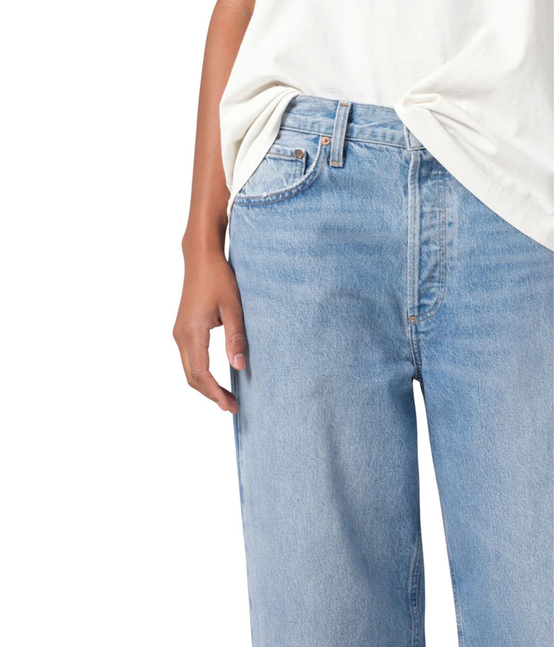 A pair of low-slung baggy jeans in organic cotton, featuring a relaxed fit that sits low on the hips. The jeans have a baggy straight leg, a longer inseam, and a soft, worn-in look. 