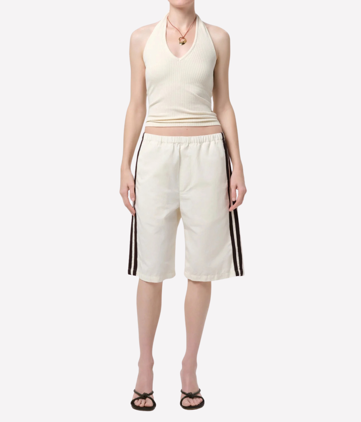Citizens of Humanity Thea Halter in Dune, full-length styling with white knee-length shorts.