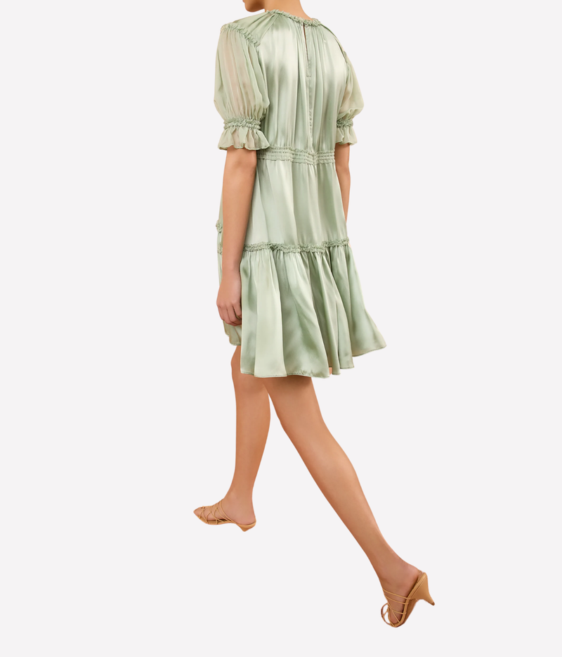 Back view of the Juliette Short Sleeve Mini Dress in Cleadon on a model, showing the gathered upper bodice, defined waist and tiered skirt.