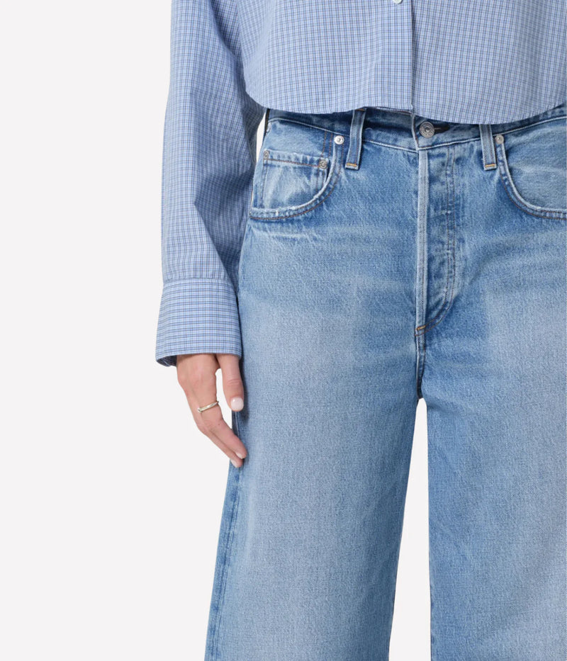 Close-up of Cupid wash denim featuring subtle fading and whiskering for a lived-in vintage look.