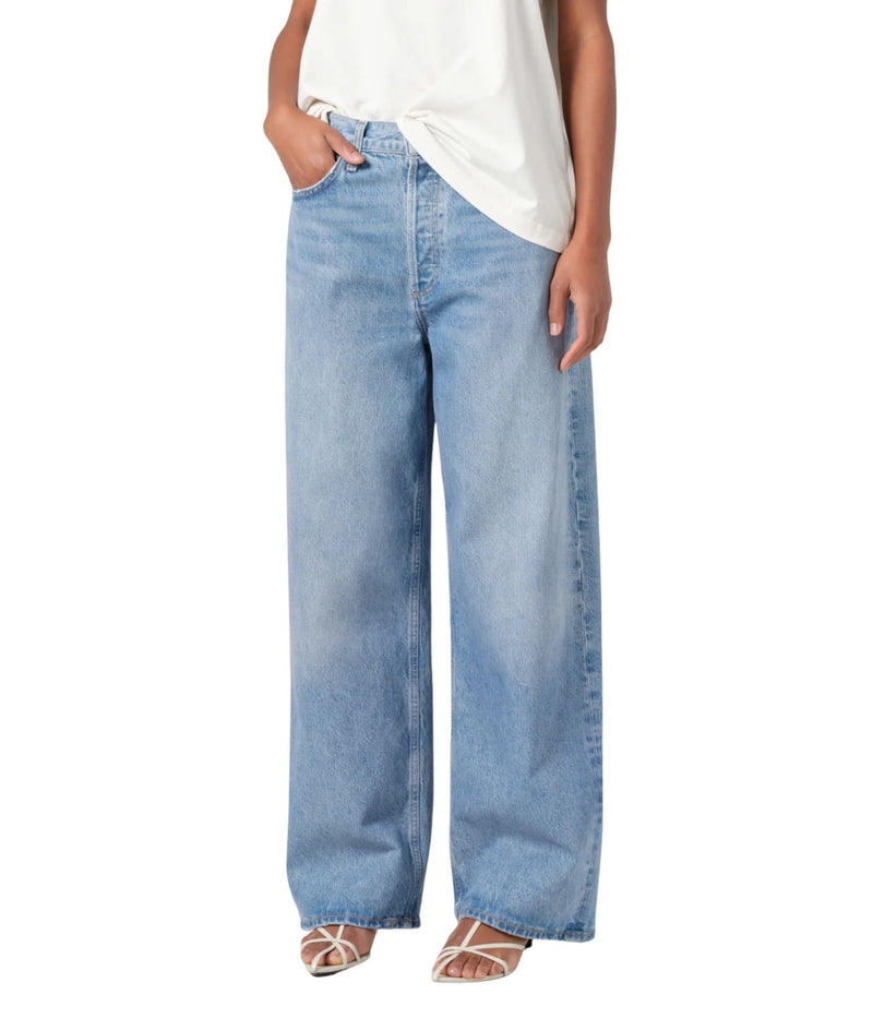 A pair of low-slung baggy jeans in organic cotton, featuring a relaxed fit that sits low on the hips. The jeans have a baggy straight leg, a longer inseam, and a soft, worn-in look. 
