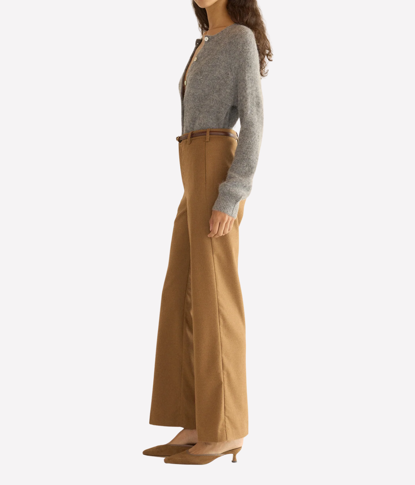 A woman wearing a grey knit cardigan with front buttons side full view