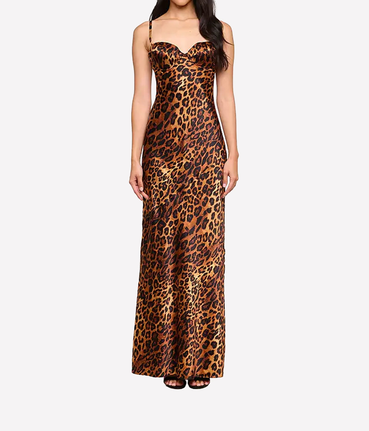 A woman modeling a leopard print silk maxi dress with spaghetti straps and a sweetheart neckline
