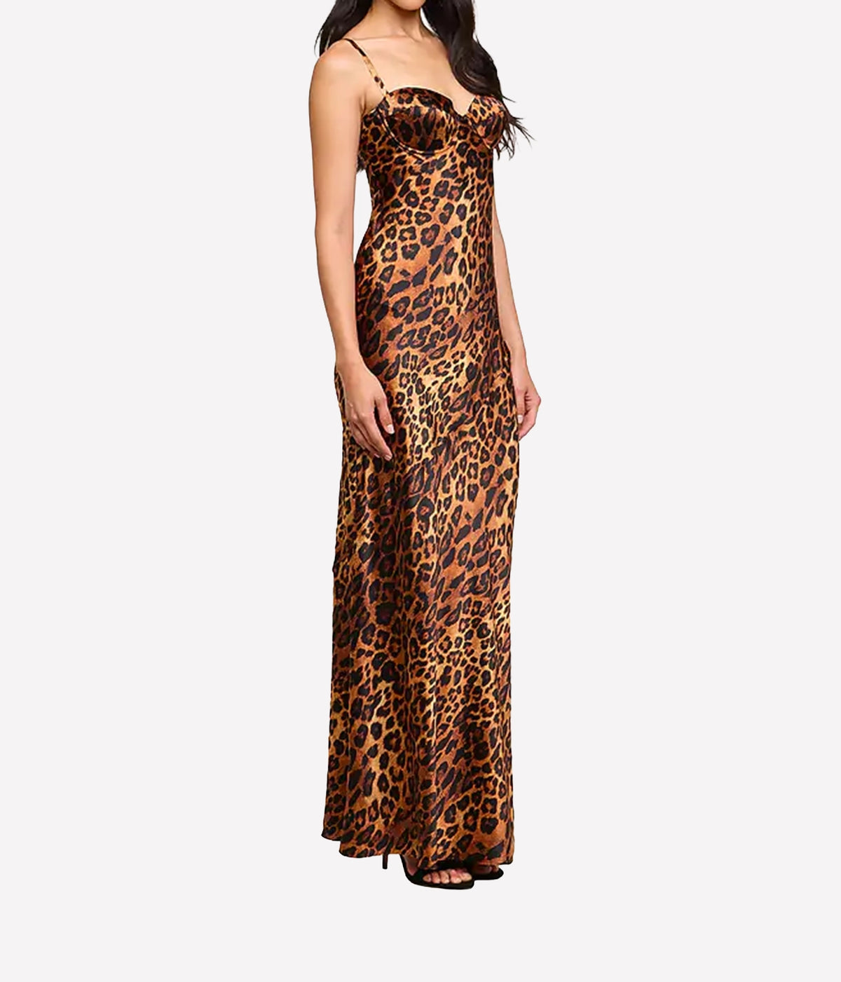 A woman modeling a leopard print silk dress with thin spaghetti straps and a sweetheart neckline.