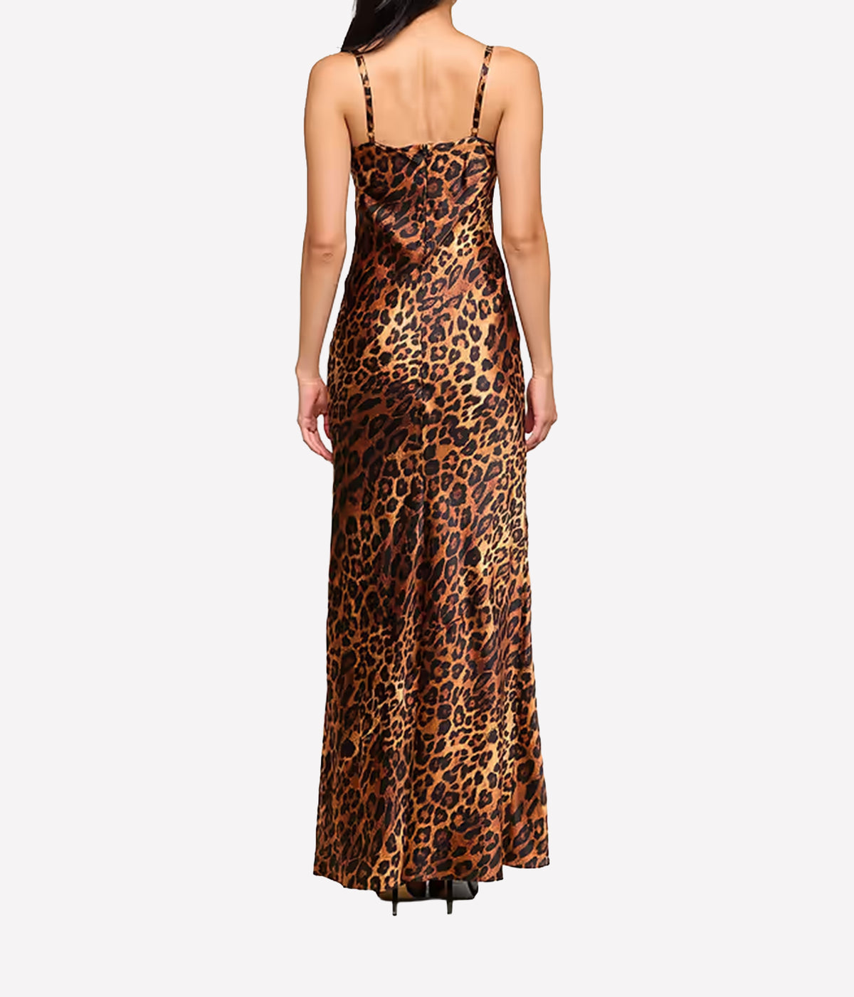 A woman viewed from the back wearing a leopard print silk maxi dress with thin straps.