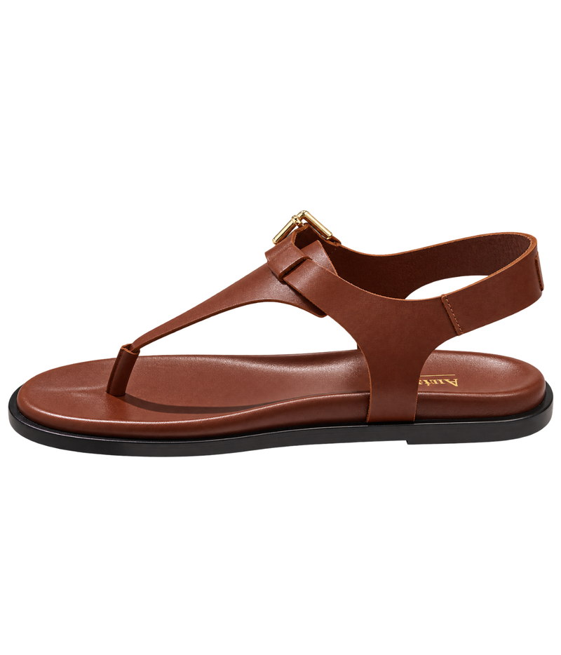 A brown leather T-strap sandal with a gold-tone buckle and a black sole - Anthology Paris Madere Sandal in Tan