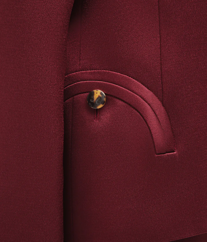 Novalis Sunfire Blazer In Wine - close up of red blazer with upside down smiley face pocket and tortoise coloured button