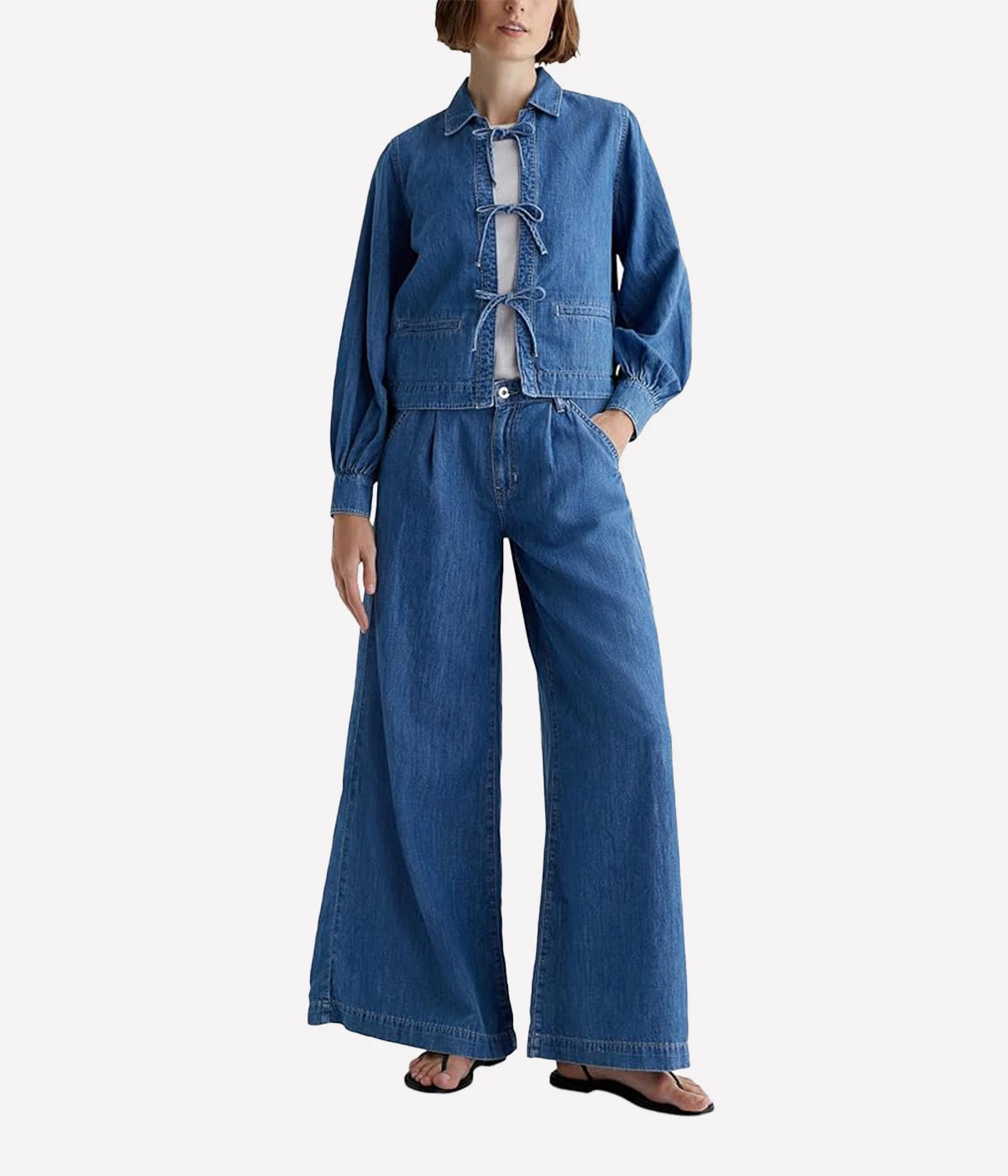 ALT text: AG Dottie denim top in Catalina wash with tie-front detail and collared neckline.