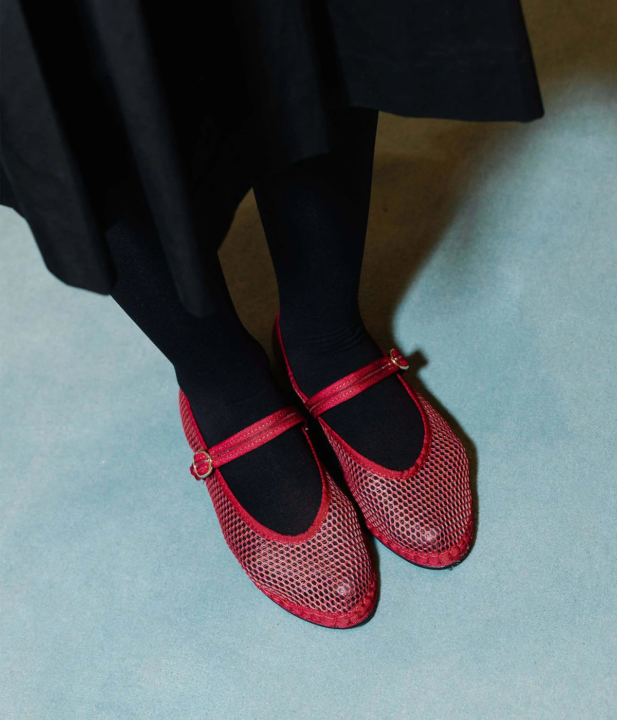 Flabelus Isabella Mary Jane flats in red mesh, worn with black opaque tights and a black skirt