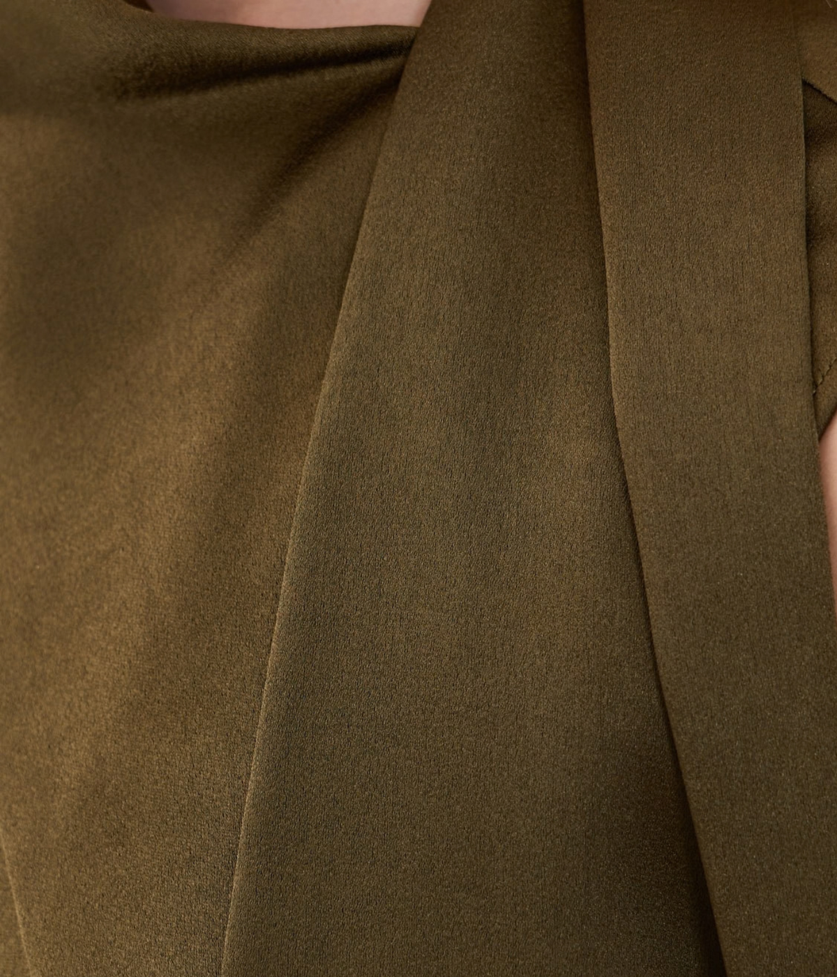 Close-up of the Vince Draped Scarf Tie Dress In Cypress showing the folded scarf tie detail and the sheen of the fabric