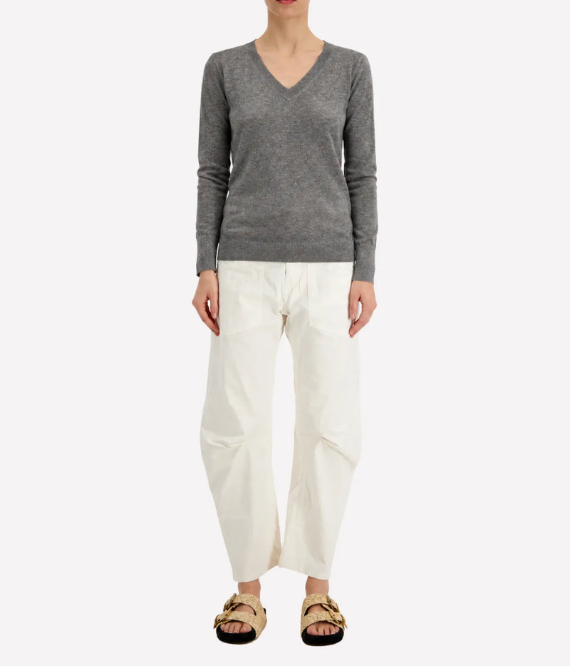 Model wearing the Avant Toi Knitted Pullover in Fango, showing the close, streamlined fit