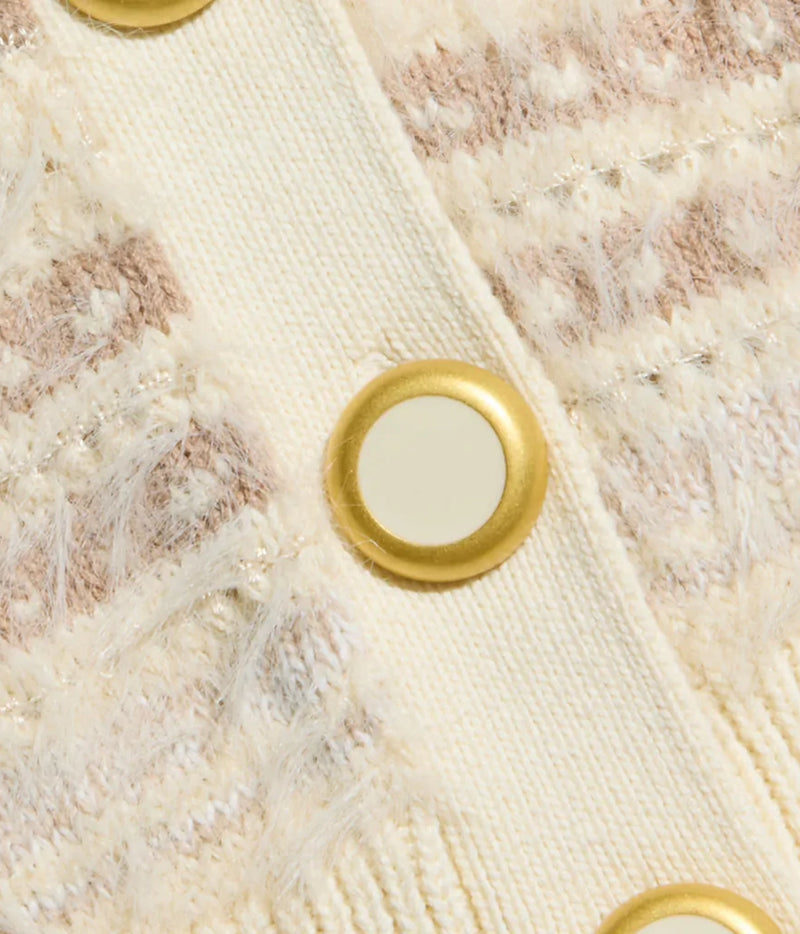 Cream textured knit cardigan with gold-tone buttons, shown in close-up.