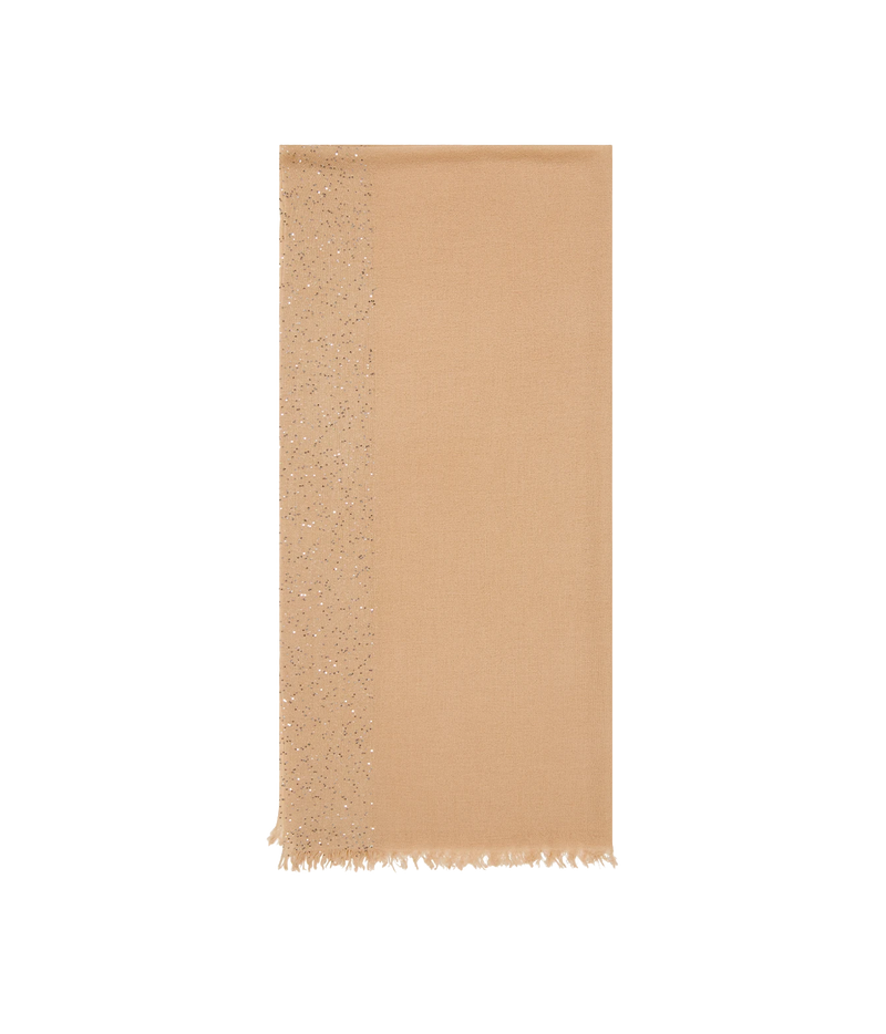 A rectangular beige scarf with a fringed bottom edge and a vertical band of shimmering sequins on the left side