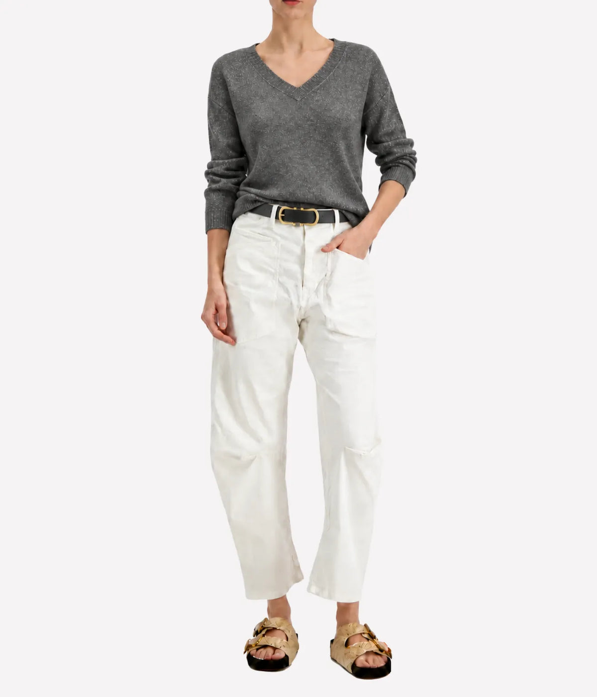 Model wearing the Avant Toi Knitted Pullover in Fango, showing the V neckline and metallic finish