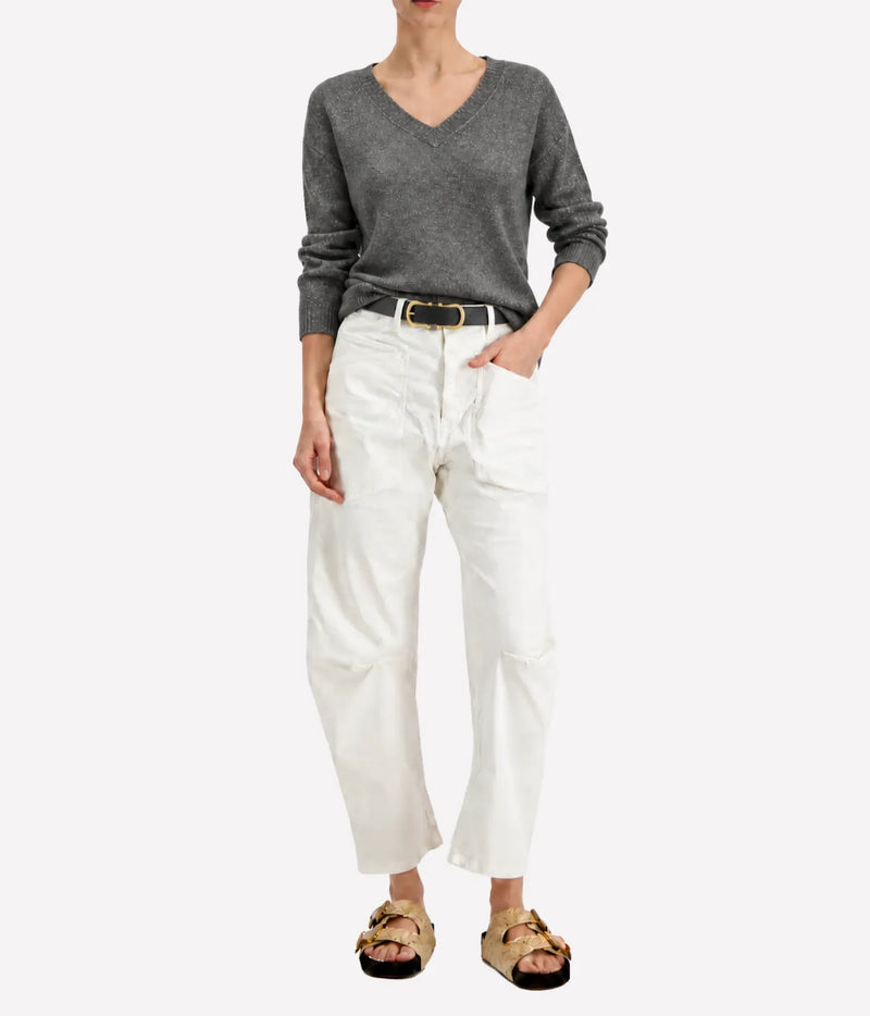 Model wearing the Avant Toi Knitted Pullover in Fango, showing the V neckline and metallic finish