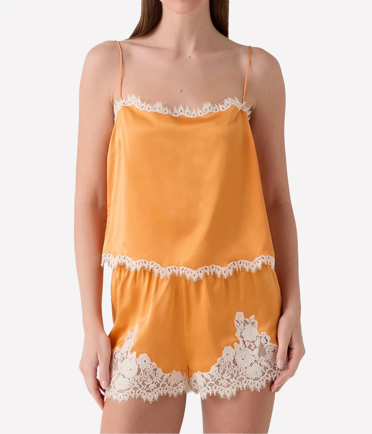 DÔEN Loure Top in Tangerine, styled with matching silk shorts, front model view.