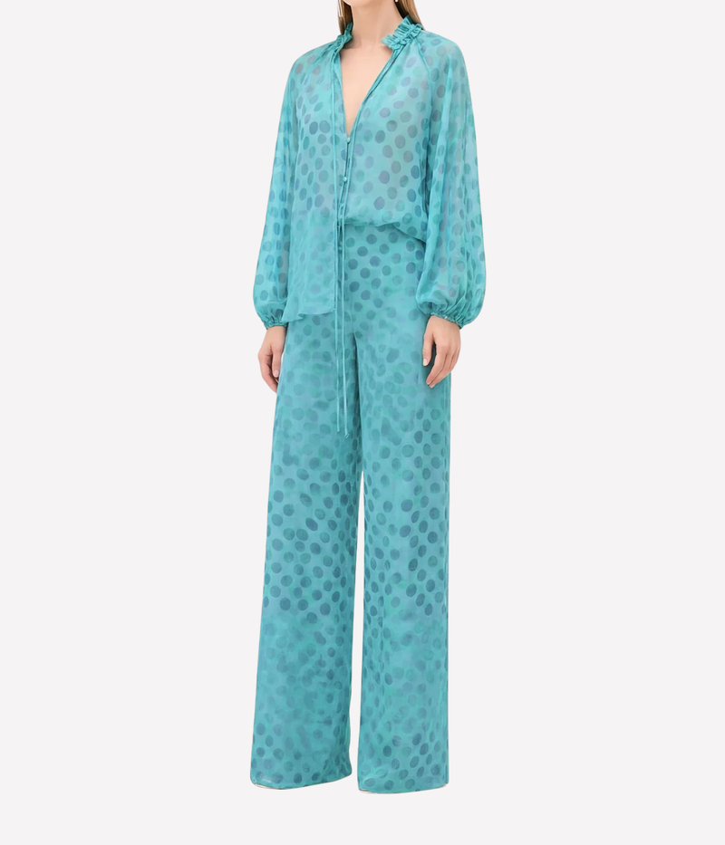 Teal polka dot outfit on a white background