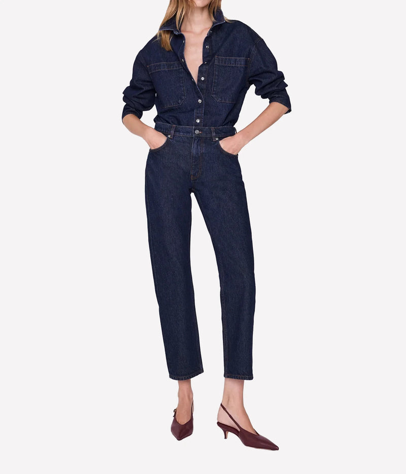 Model styling the Anine Bing Samy Shirt in Unwashed Blue tucked into matching cropped denim jeans.