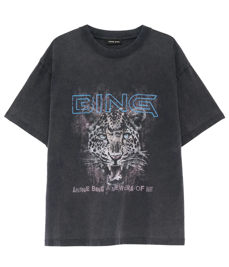 A washed black graphic t-shirt featuring a leopard print design with the text 'BING' in blue outline letters and 'ANINE BING A NEW ERA OF ME' printed below, shown on a plain white background.