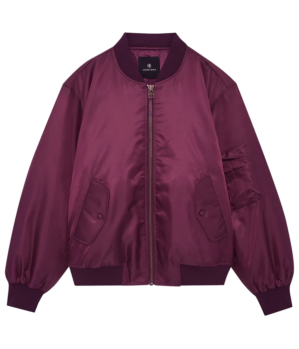 A satin bomber jacket in a deep plum purple color, featuring a front zipper, ribbed collar, cuffs, and hem, with flap pockets on the front and a utility pocket on the sleeve, shown against a plain white background.