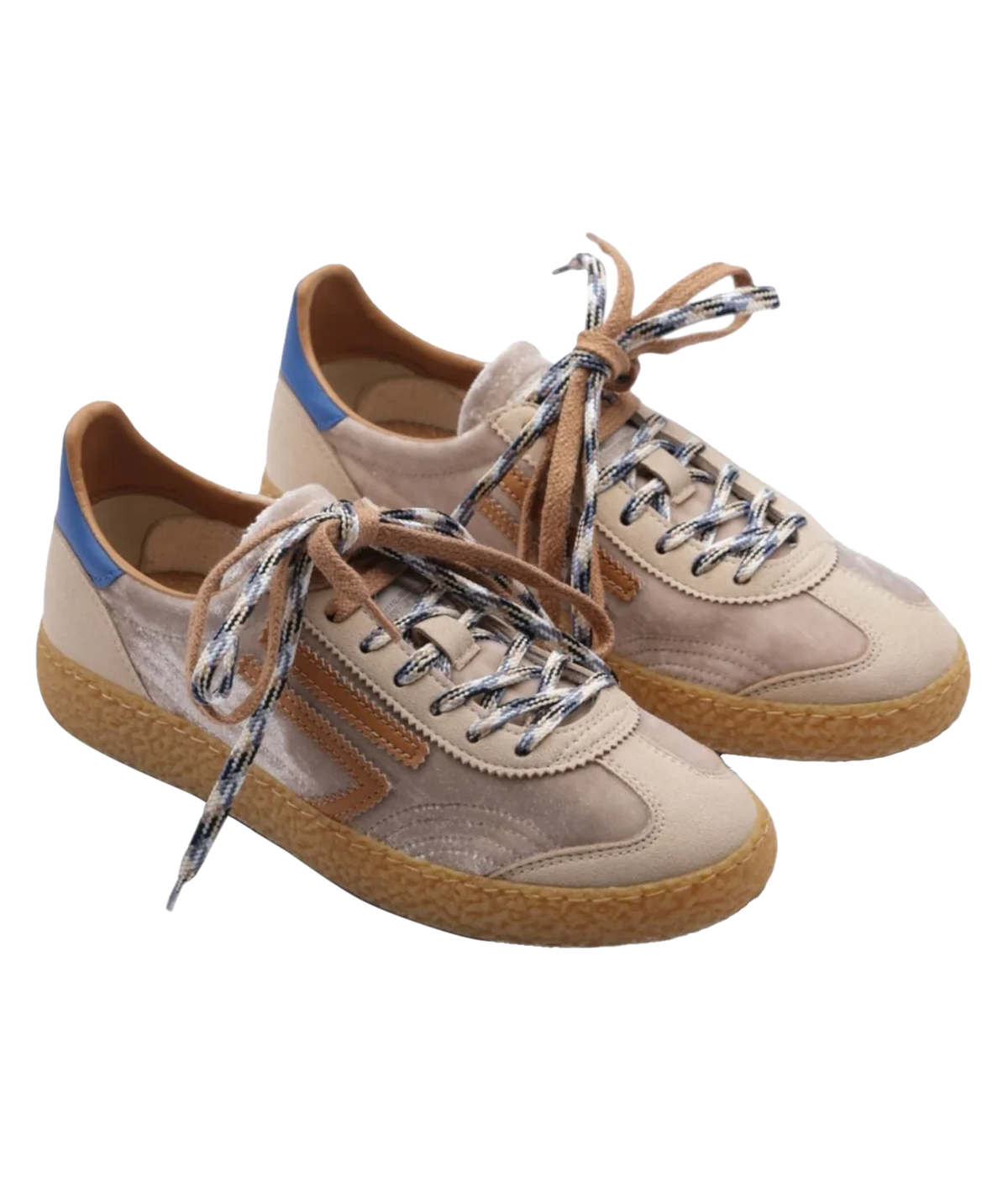 A pair of low-top suede sneakers in beige and tan, featuring patterned laces, a blue heel accent, and a textured gum sole, shown on a plain white background.