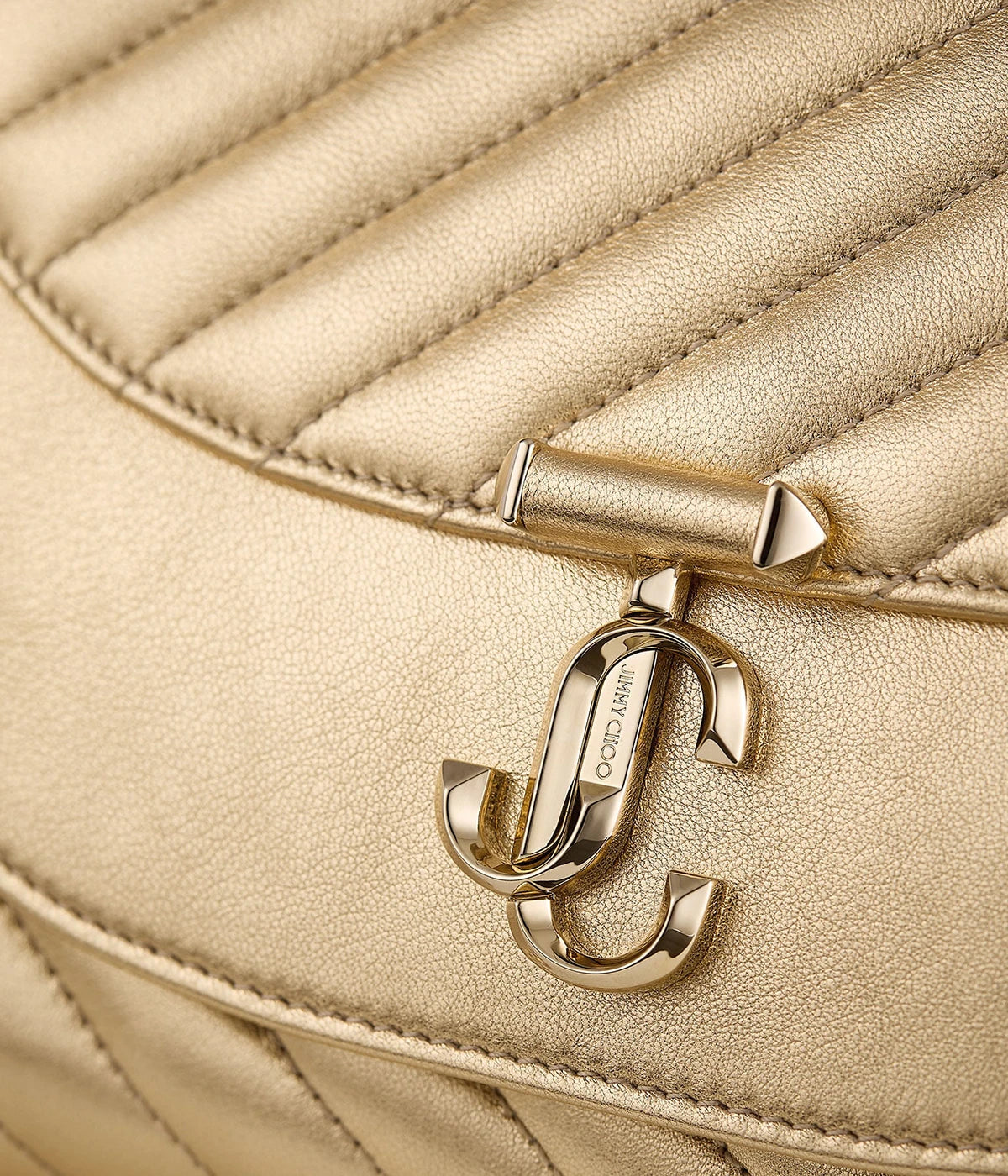 Ava Curve Clutch In Shiny Gold