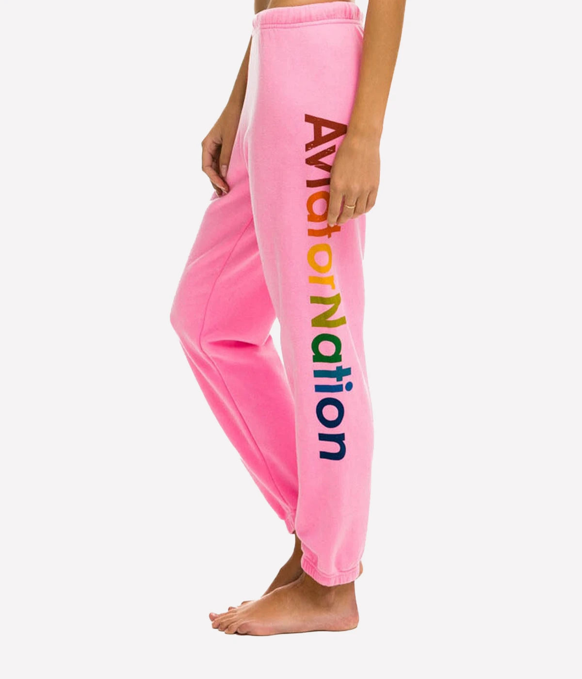  Ultra-soft sweatpants with unique stitching detail, shown in a casual lounge setting.