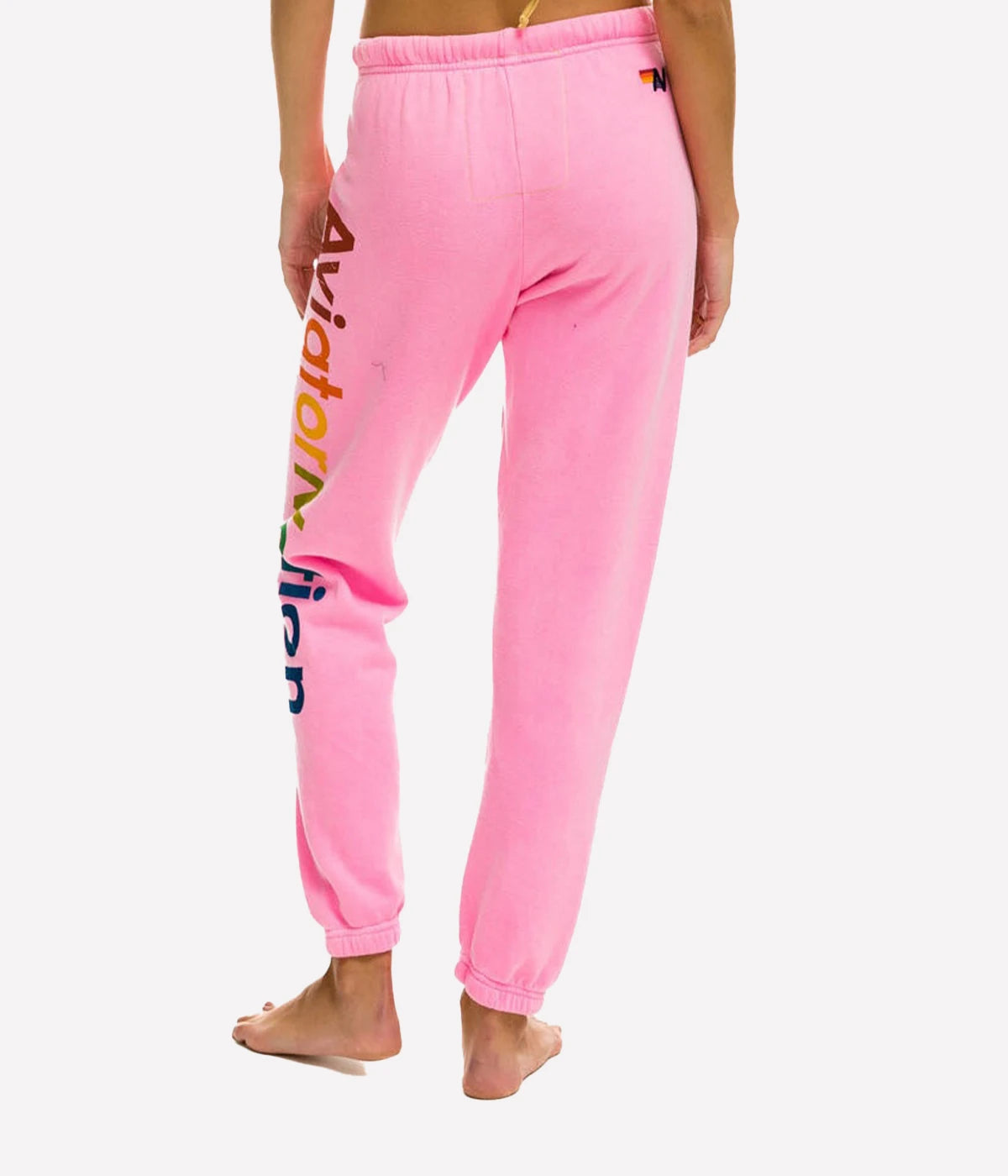  Ultra-soft sweatpants with unique stitching detail, shown in a casual lounge setting.