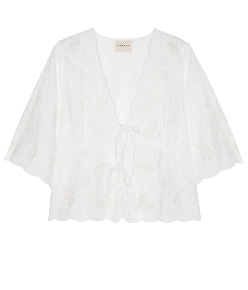 A white eyelet lace top with a deep V-neck, tie-front detail, and wide elbow-length sleeves, shown flat against a white background.