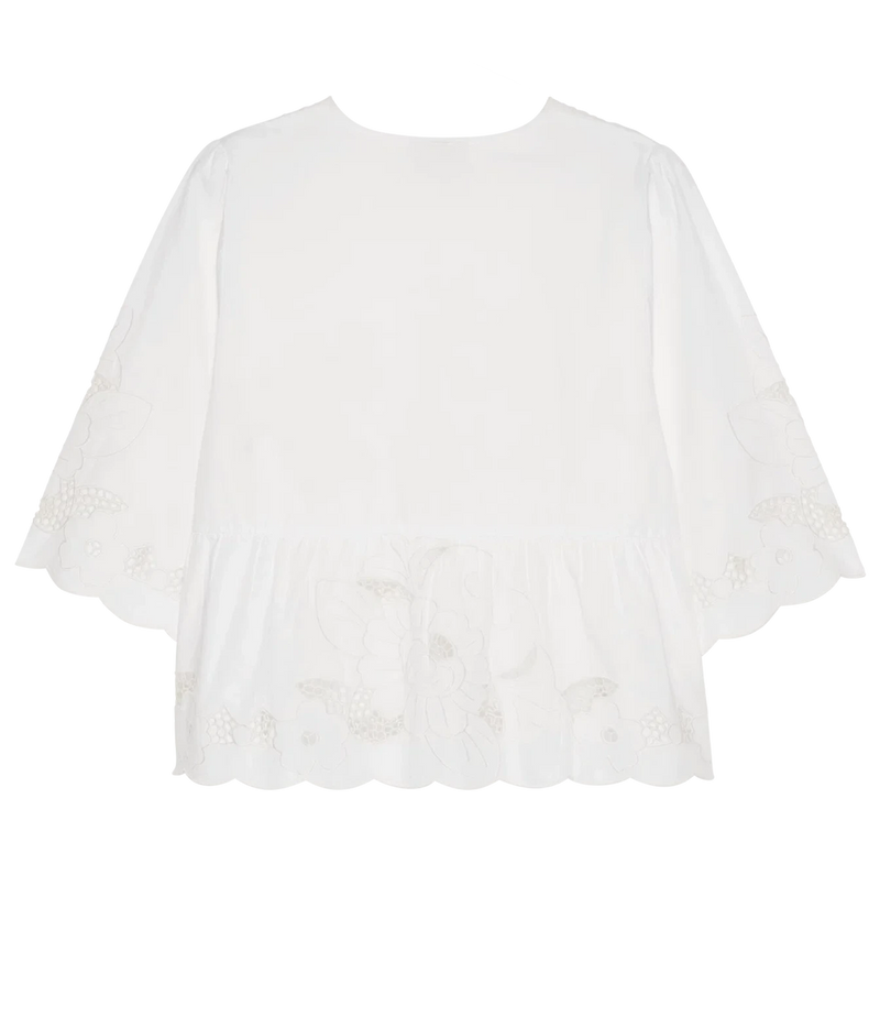 White short-sleeve blouse with embroidered floral details and a ruffled scalloped hem, shown flat on a white background.
