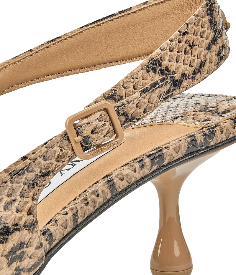 Close-up of a women's slingback high heel shoe with a snakeskin-patterned upper, beige leather strap, and glossy nude heel on a white background.