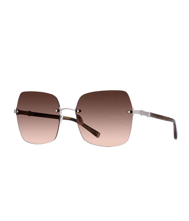 ALT text: Butterfly silhouette sunglasses with 24KT gold-plated filigree detailing, titanium Zyl frame, and anti-reflective nylon lenses.