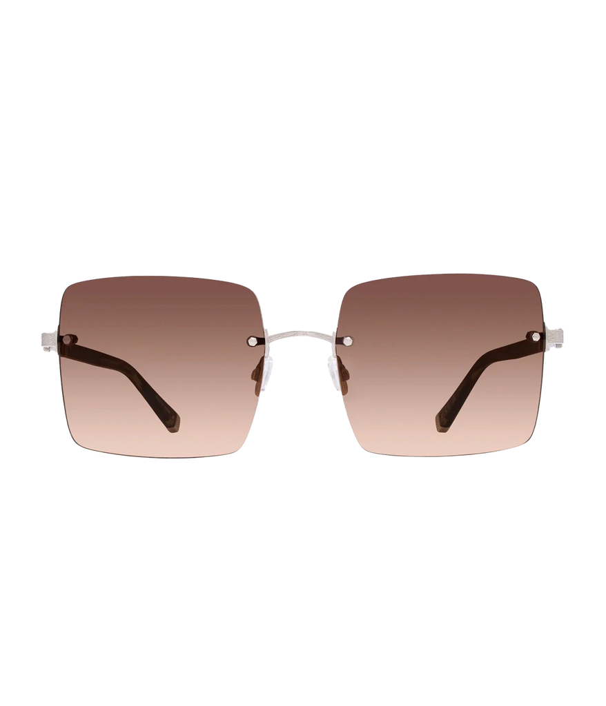 A bold sunglass, in a rose gold hue in a chic butterfly silhouette, made in Japan, 24K gold plated, throw on and go, one of a kind, comfortable, neutral sunglasses, 90s inspired. 