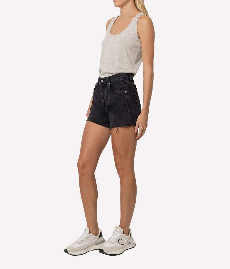 Citizens of Humanity Annabelle Long Short Jean in Black Sea worn on model, full length side view of longline denim shorts styled casually
