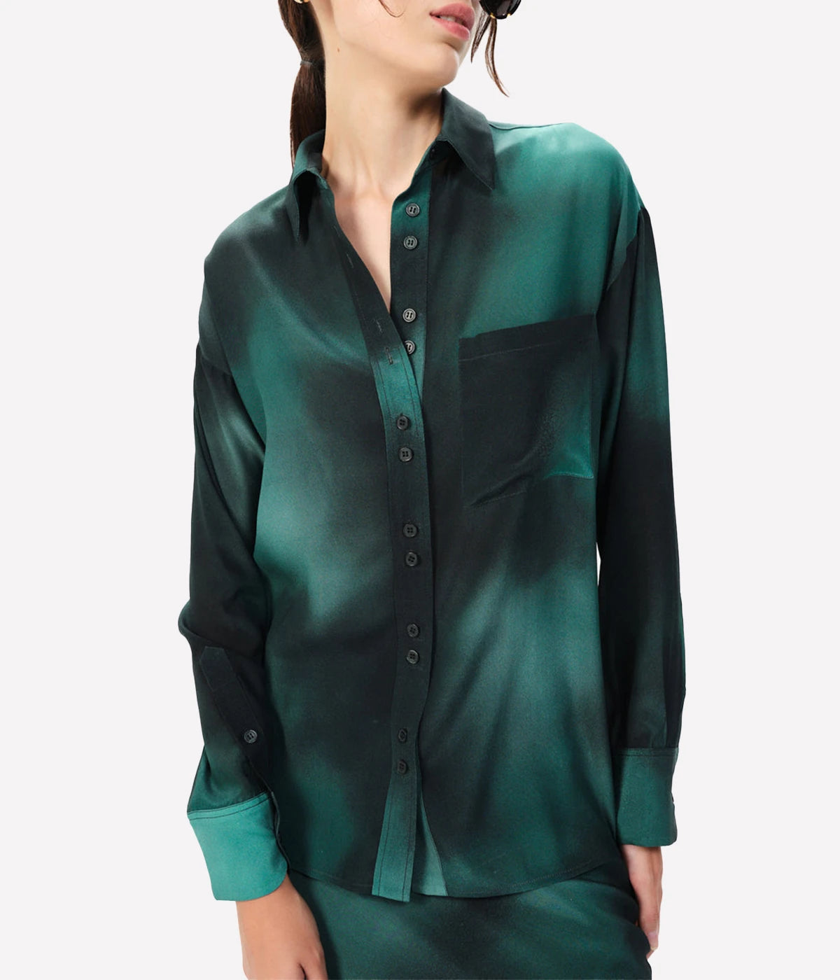Vibrant Emerald Hue: Inspired by the enchanting southern Argentinian landscapes, the deep emerald green adds a bold yet refined touch to your wardrobe.
Luxurious Silk CDC: Made from 100% Silk CDC, this fabric offers a smooth, soft feel with a slight sheen, exuding sophistication.
Timeless Design: The long sleeves, button-front closure, and front pocket contribute to a classic, versatile look that can be dressed up or down.