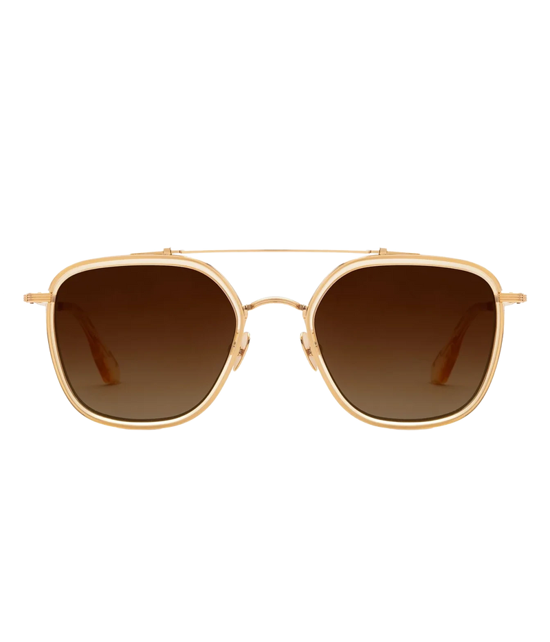Front view of the KREWE Austin Sunglasses in 18K Titanium Champagne, showing the champagne acetate rims, gold brow bar and brown gradient lenses