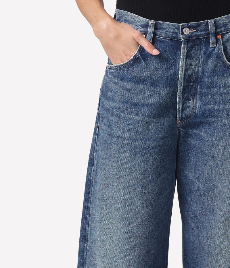  Relaxed-fit Ayla Jeans with a cuffed leg, styled with an oversized blazer and boots for a chic, vintage-inspired look.