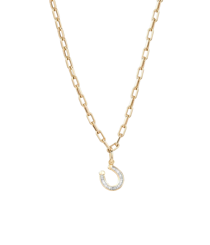 Adina Reyter Baguette Horseshoe Charm in 14k Yellow Gold hanging from its hinged bail on a fine gold paperclip chain