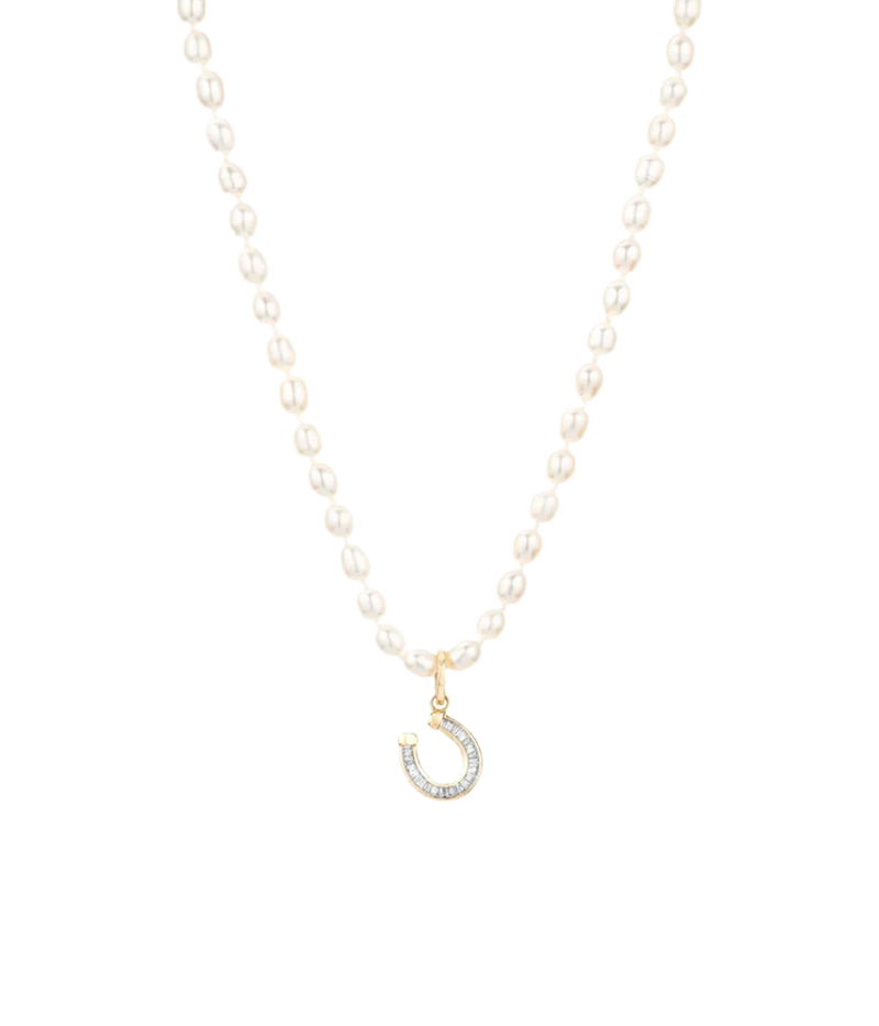 Adina Reyter Baguette Horseshoe Charm in 14k Yellow Gold clipped onto a strand of small oval pearls